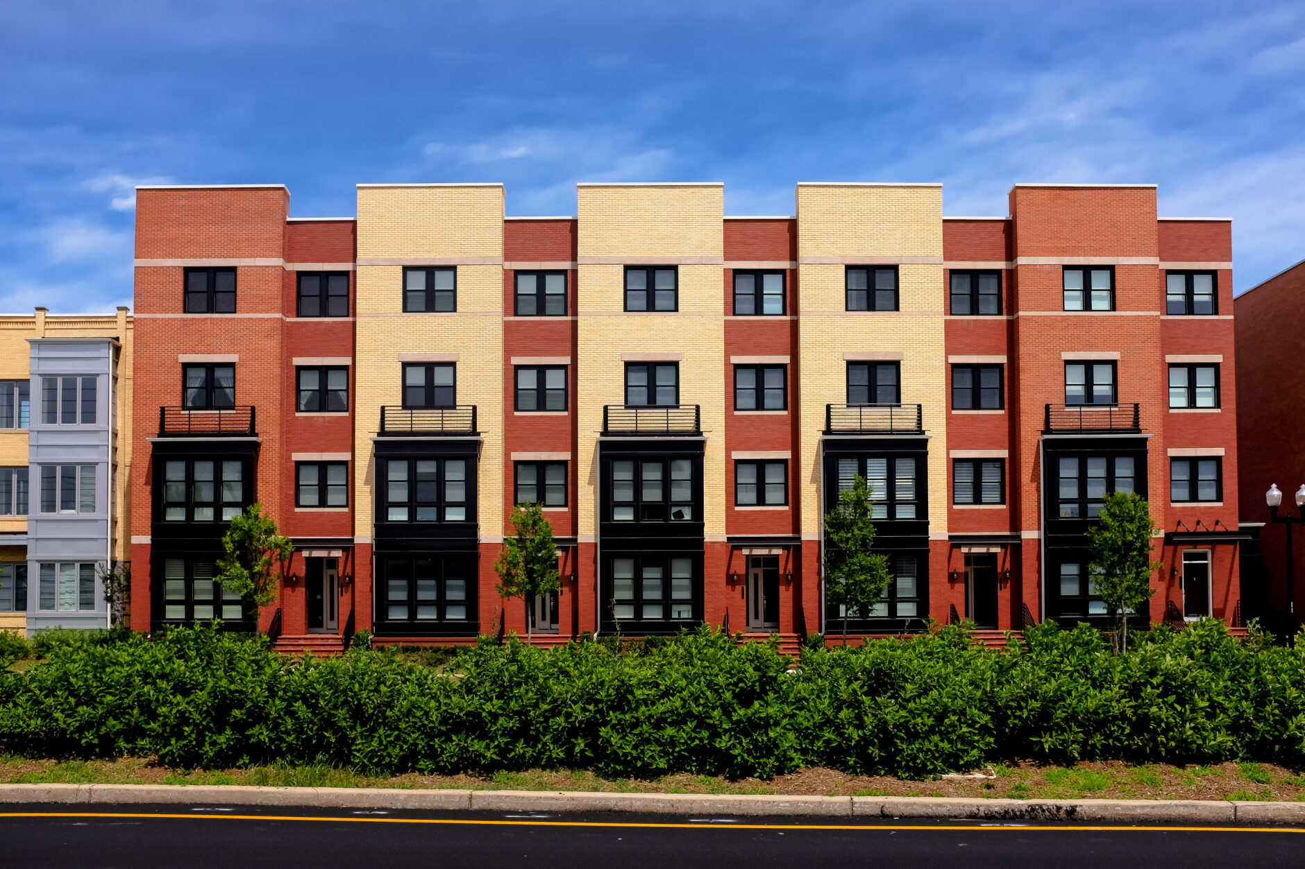 Modern apartment buildings on a sunny day with a blue sky modern apartment buildings on a sunny day with a blue sky